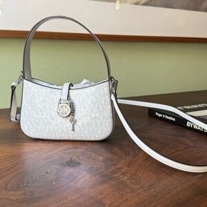 Michael Kora Lyra Extra-Small Signature Logo
Crossbody Bag